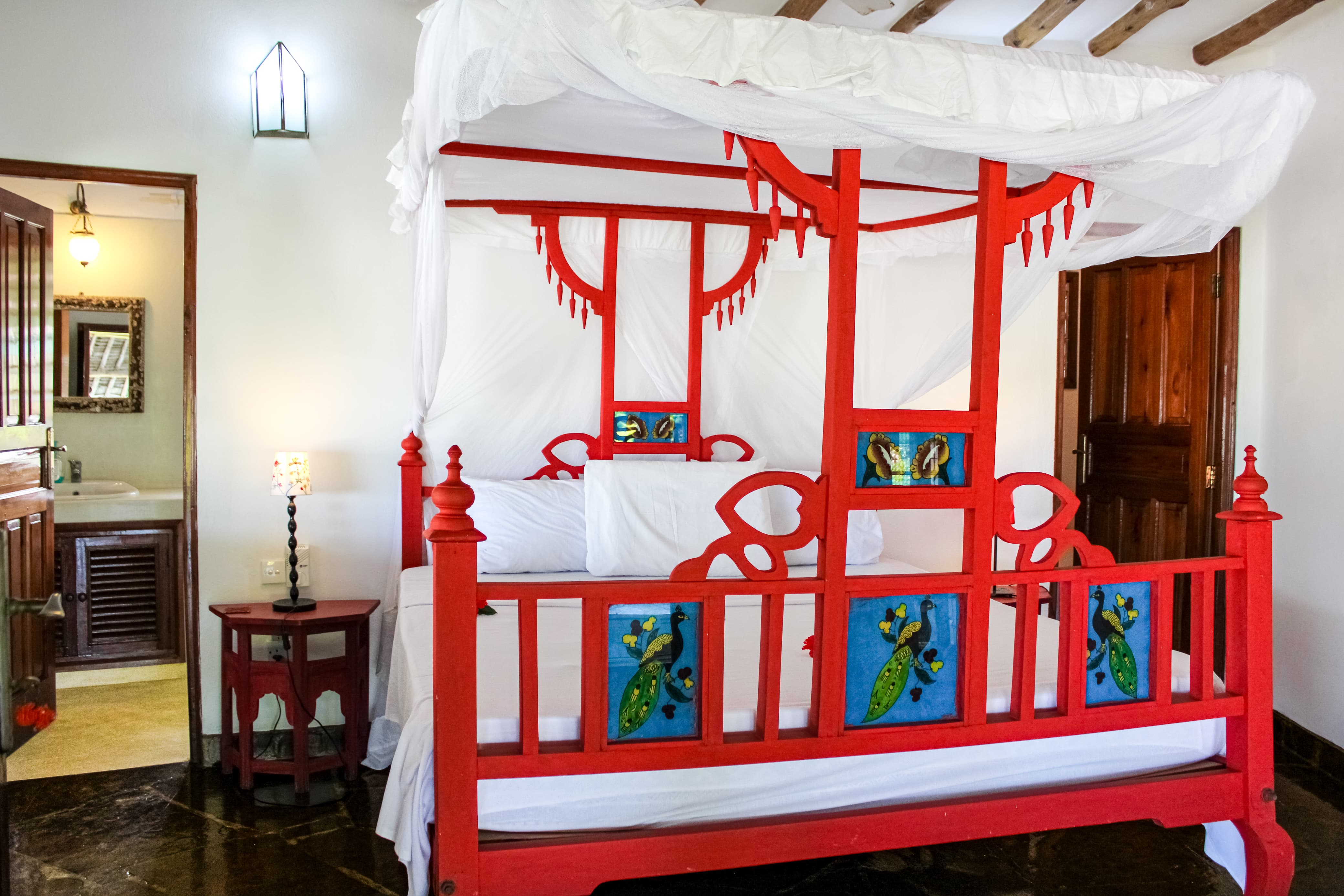 Spacious bedroom inside Nyumba Stella beachfront villa