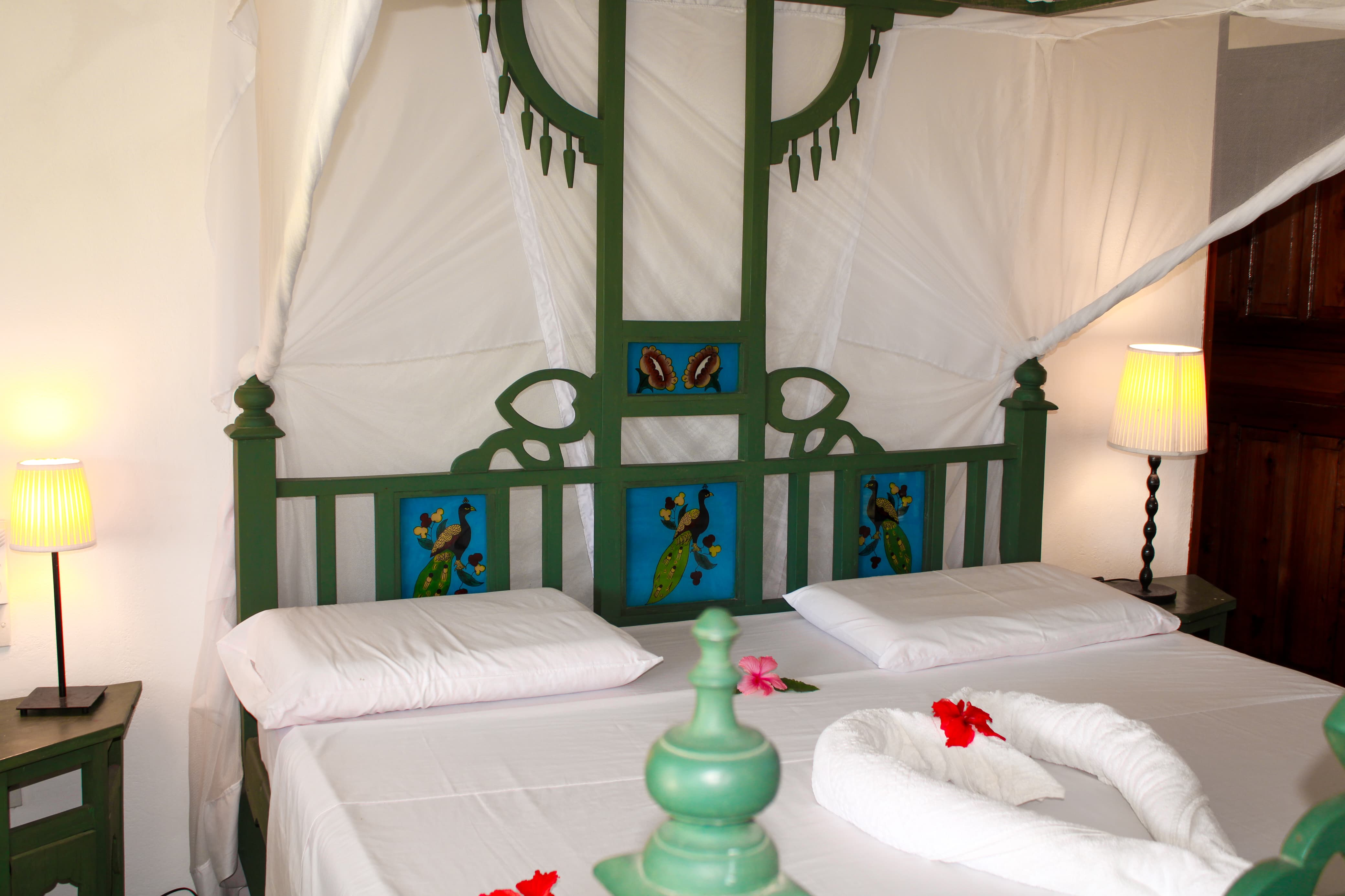 Spacious bedroom inside Nyumba Stella beachfront villa